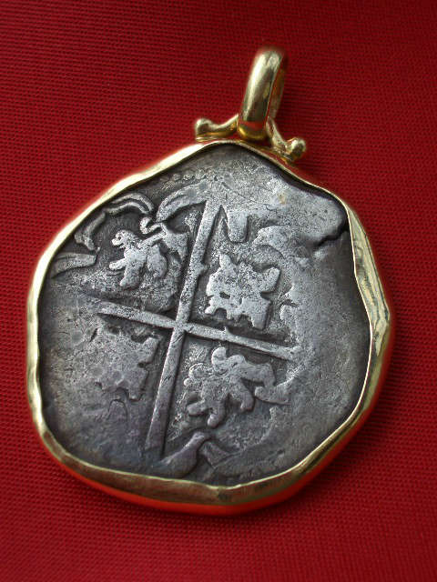 1635 Spanish Colonial 8 reale silver cob coin in 18K gold bezel. Minted in Potosi, Bolivia and recovered from the wreck of the Nuestra Senora de la Concepcion. Comes with a letter of authenticity. Super nice piece of jewelry!