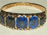 English Victorian 9K gold ring with 5 blue sapphire stones, marked A.J. Co., .375, size 7, weighs 1.8 grams