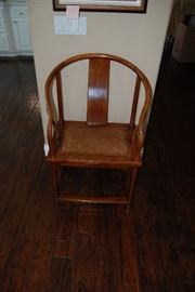 Antique Chinese Walnut arm chair with cane seat.  Made in Shanxi, China circa 1850.  Purchase by Atelier Katayon