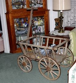 Note: this photo is to primarily show the wagon,, family heirs have removed many items from corner cabinet. 