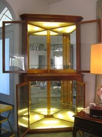 Amazingly well made solid cherrywood illuminated corner curio cabinet. 