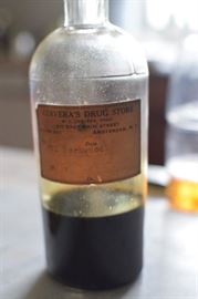 Antique bottles with paper labels still intact.