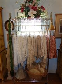 Vintage and antique hand-crocheted coverlets, as well as four panels of satin curtains. 