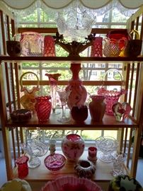 Cranberry, Burmese, clear and cased glass. 