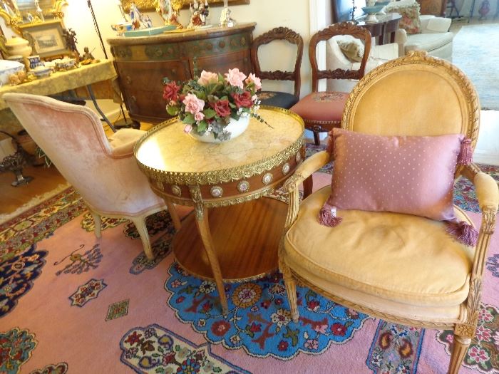Substantial French marble-top circular table with hand-painted medallions and velvet side chairs. 