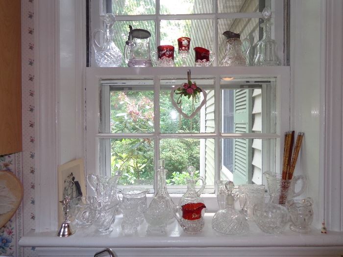 Windowsill of additional fancy glass pieces. 