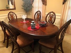 Oval Dining Room Set. Table is heavy wood with inlay design. 44x92x26, with leaf (44x29) 