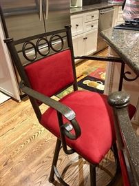 Red suede and iron bar stools (one of three)