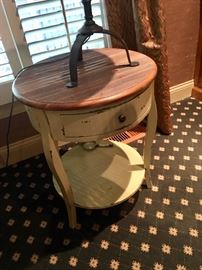 One of two distressed side tables