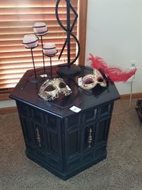 side table, masks, lamp