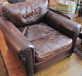 35. #2 Distressed Brown Leather Chair from Restoration Hardware