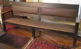 64. Long, Heavy Oak Station Bench with Brown Leather Seat and Back Panel. Approx. 96" L x 24" W x 40" H (circa 1930's)