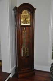 Howard Miller Grandfather Clock with ships and globe details. 19.5" w x 80" h x 14.5" d 