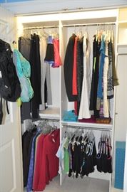 Closet filled with teen clothing including new yoga clothes