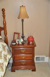 The second 3 drawer American drew nightstand shown with one of the 2 candlestick table lamps available 