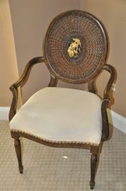 Vintage mahogany side chair with cane circle back and hand painted Victorian scene. 