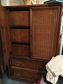 Large armoire with drawers inside.