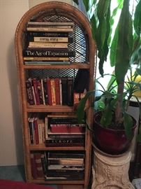 Vintage rattan shelf—lots of coffee table books.