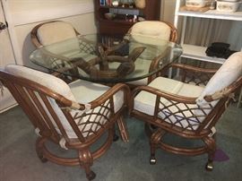 Vintage Classic Rattan, Inc. couch, recliner, dining table and 4 chairs and end table.