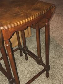Side view of Baker drop-leaf end table