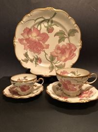 Rosenthal China set in Rigoletto pattern with Pompadour Gold trim, dinner plate, footed demitasse cup with saucer and footed teacup with saucer.  A total of 9 dinner plates are available as well as demitasse cup & saucer and  9 teacups & saucers
