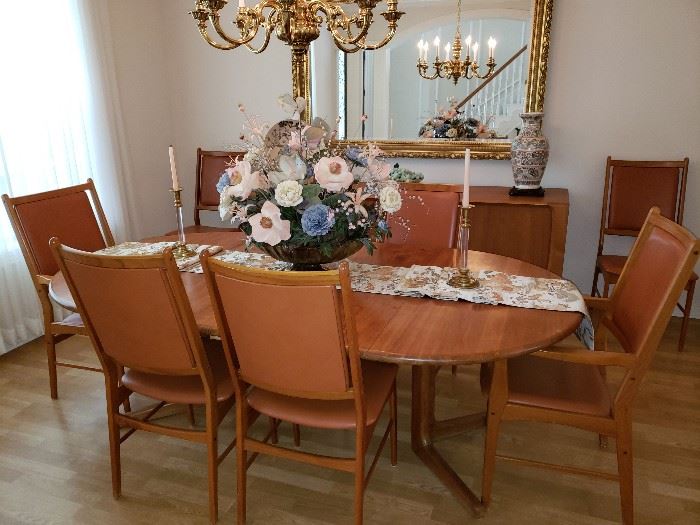 Round Scandavia Teak formal dining table- with 2 extension leaves (shown w/ both extension leaves inserted)
8 Teak & leather chairs (2  captain chairs)