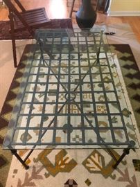 Metal based table with glass top