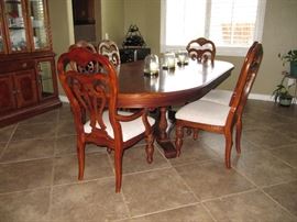 Elegant Dining Room Table and chairs with custom pads