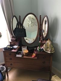 Antique Vanity with Three Oval Beveled Mirrors and Casters on Legs