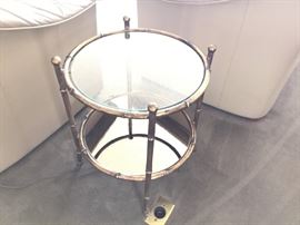 Small metal Bamboo style end table. Mirror on bottom shelf, Glass Top.