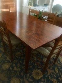 Beautiful curly maple table (6’6” by 42” without extensions and 9’6” with the two end of table extenders/leaves) and 8 chairs