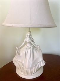There are a pair of porcelain lamps