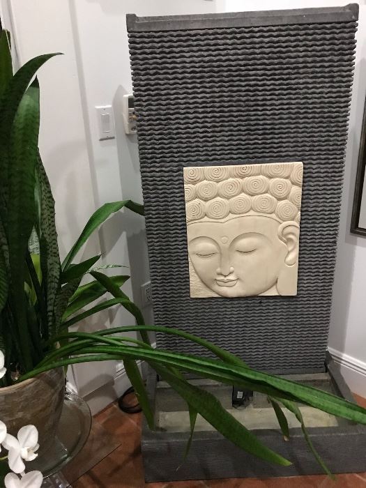 Tall slate indoor/outdoor fountain w/Carved Buddha Face. Dimensions:
5’ H x 31 1/2” W x 17 3/4” D