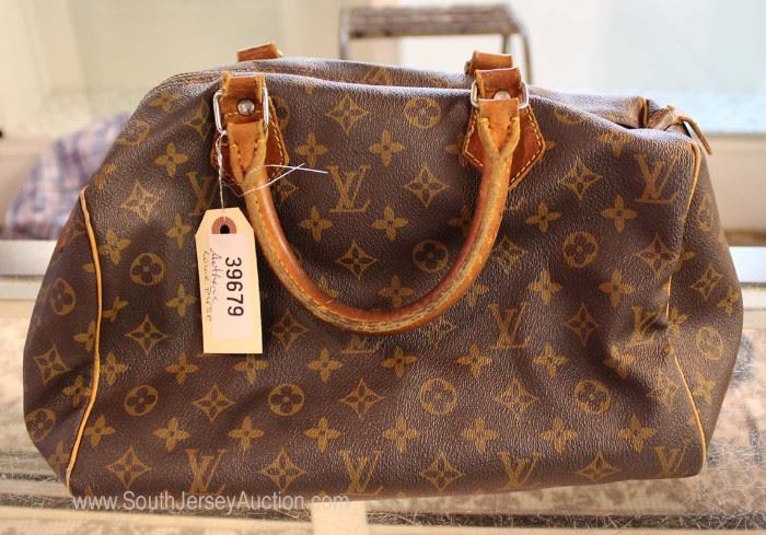 Certify Louis Vuitton Purse
Located Inside – Auction Estimate $300-$600
