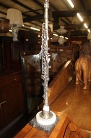 Intrrment made into a lamp.