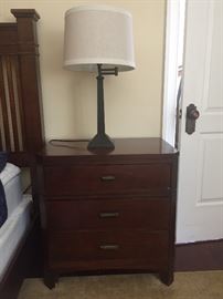 One of a pair of side tables and one of a pair of contemporary lamps