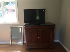 Marble top dresser, gold mirror and TV