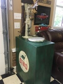 Repurposed oil pump made into to a cabinet/end table