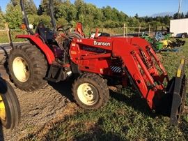 Branson tractor 2810 with forks and bucket