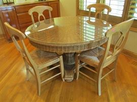 The wicker kitchen table and chairs. Glass top on table. 
    48"