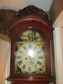 Face of Scottish grandfather clock, showing wonderful scenery on the face of the clock