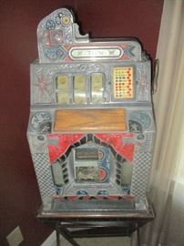 Antique Mills machines nickel slot machine on metal stand, in working condition, with original keys, woodside's, metal front and back, model 447