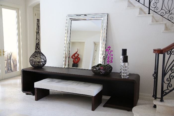 Mirror, candleholders and brown decorative bowl are sold.