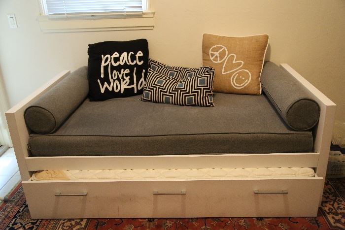 Peace love world pillows (black and tan) are sold.
