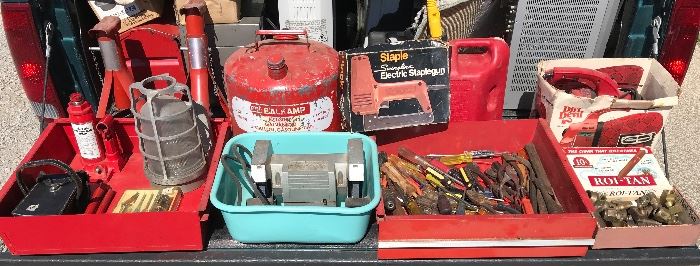 Jack stands, Wall Light, Sears 5" bench grinder, Old 5 Gal Gas can. Swing line elec stapler, Flat full pliers, chisels, screwdrivers, Brass pieces,Dirt Devil Vac