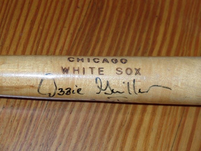 Autographed bat by Ozzie Guillen