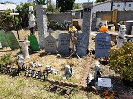 Great outdoor Halloween decor gravestones, fence, pillars