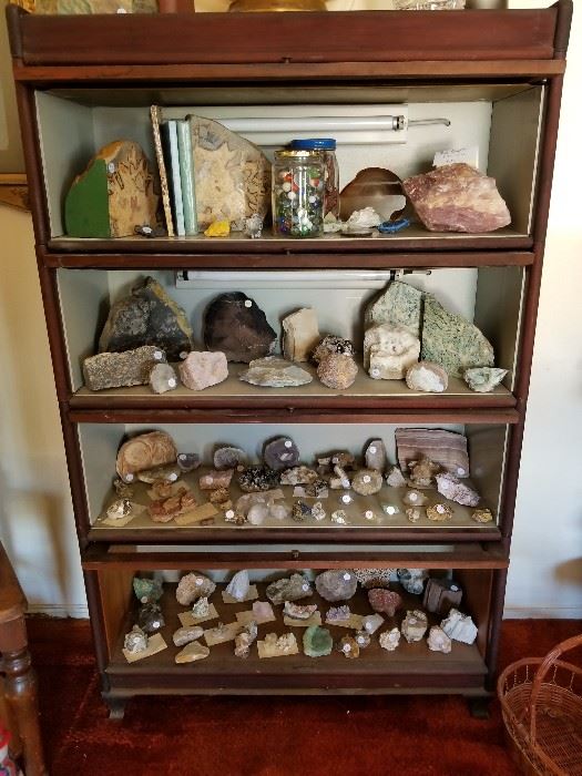 Lawyer's bookcase with lights for display. Hand cut, natural huge stone bookends, huge piece of rough rose quartz