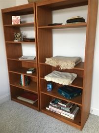 Matching bookcases with adjustable shelves.