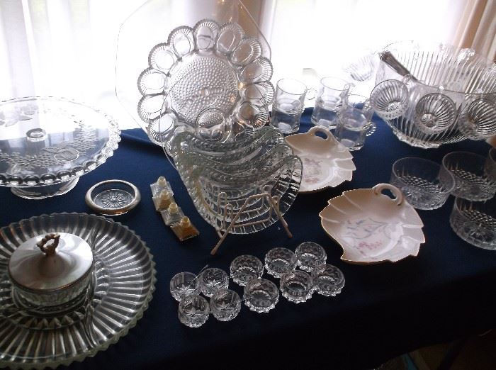 Pressed glass cake stand, egg tray, relish tray, salts w/spoons, and punch bowl set